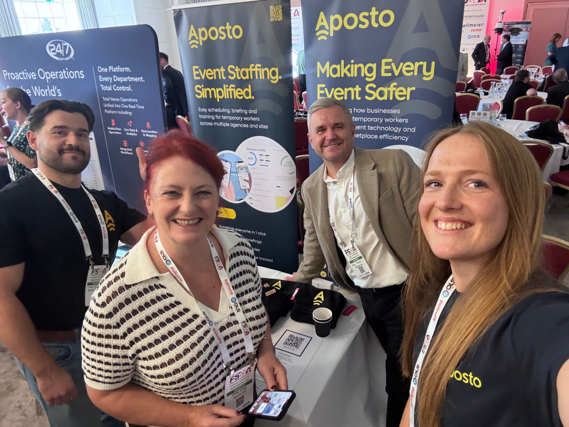 The Aposto team at their event stand, with the Making Every Event Safer banners behind them